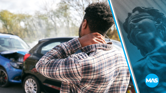 Man holding neck in pain after a car accident.