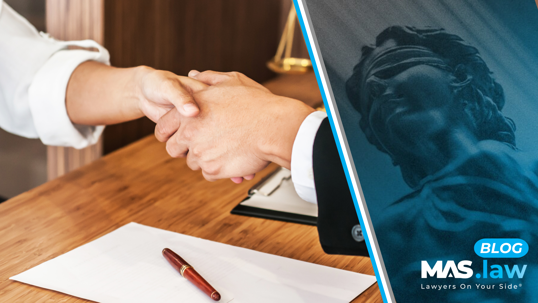 Shaking hands in a meeting.