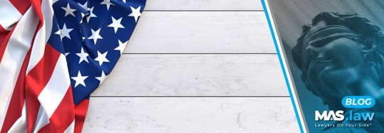 The American Flag with a wood board background | MAS Law