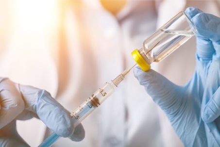 doctor preparing a vaccine injection