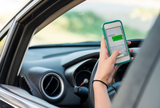 Someone texting while driving | MAS Law