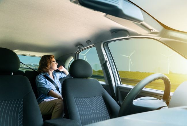 Woman in a self-driving car | MAS Law