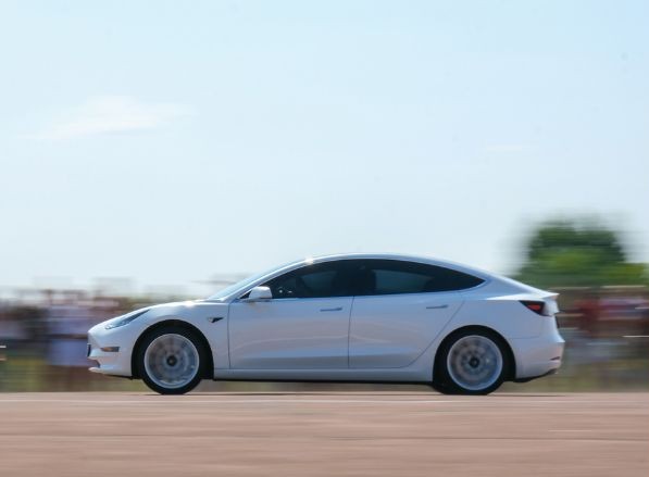 Tesla speeding down the road | MAS Law