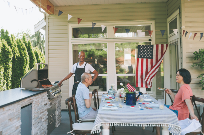 Friends gather on a porch for Labor Day party | MAS Law