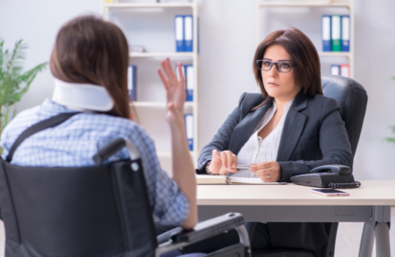 An injured woman is frustrated with an insurance adjuster | MAS Law