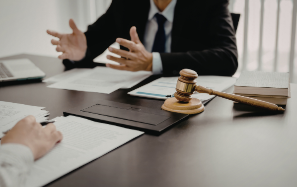 A lawyer arguing at a desk | MAS Law