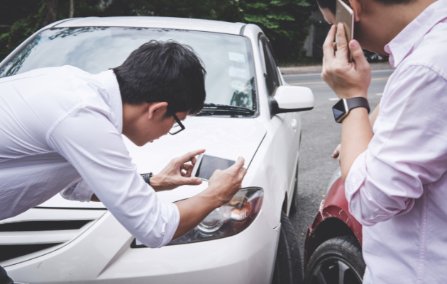 Taking a photo of vehicle damages after a crash | MAS Law