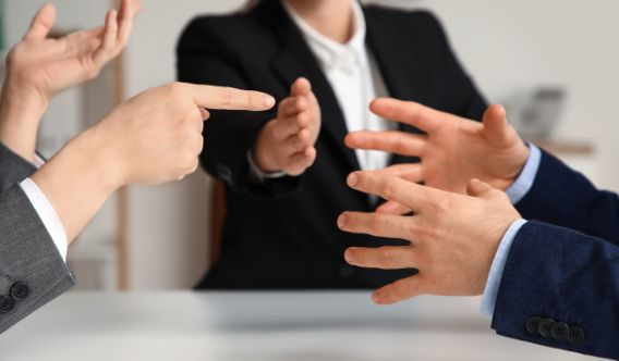 Two people arguing in an office | MAS Law
